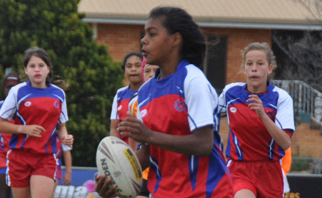 STANDOUT: Ashleigh Isaacs, the Darling Downs Red player’s player of the carnival, runs the ball during the grand final against Capricornia. STANDOUT: Ashleigh Isaacs, the Darling Downs Red player’s player of the carnival, runs the ball during the grand final against Capricornia.